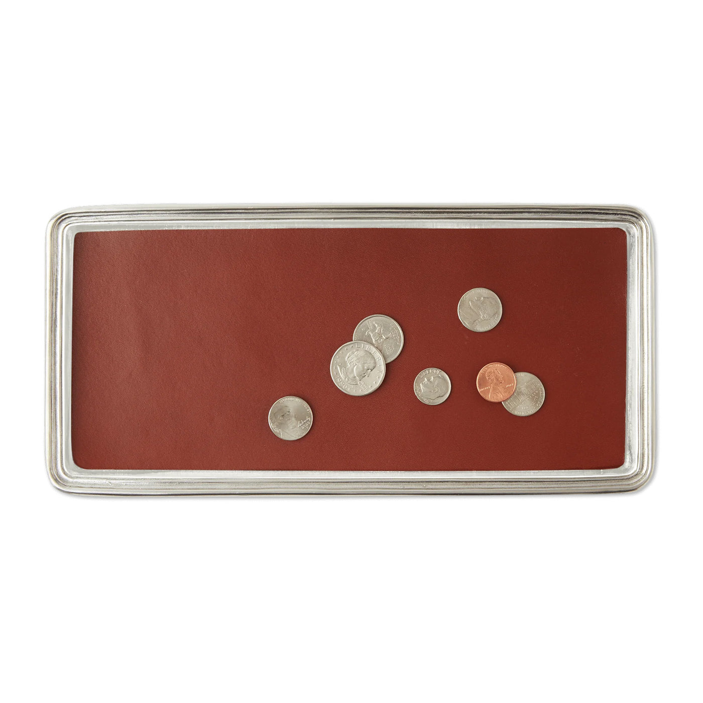 A rectangular pewter vanity tray with a red leather insert, featuring a small selection of silverware placed on it.