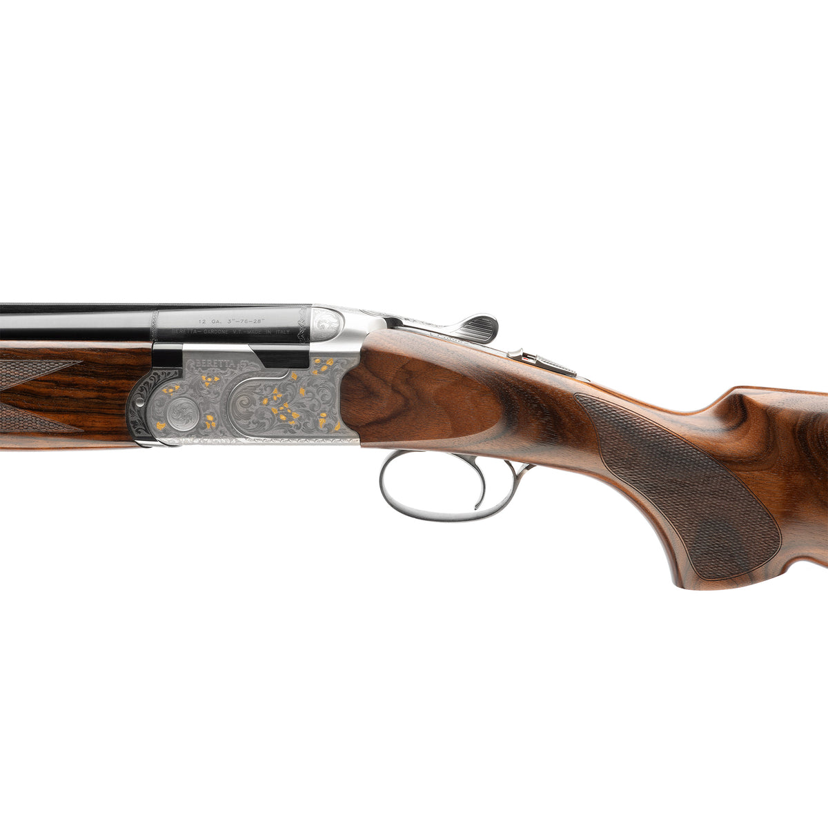 Close-up side view of a double-barrel shotgun with a polished wood stock, engraved metal receiver, and silver trigger guard, shown against a plain white background.