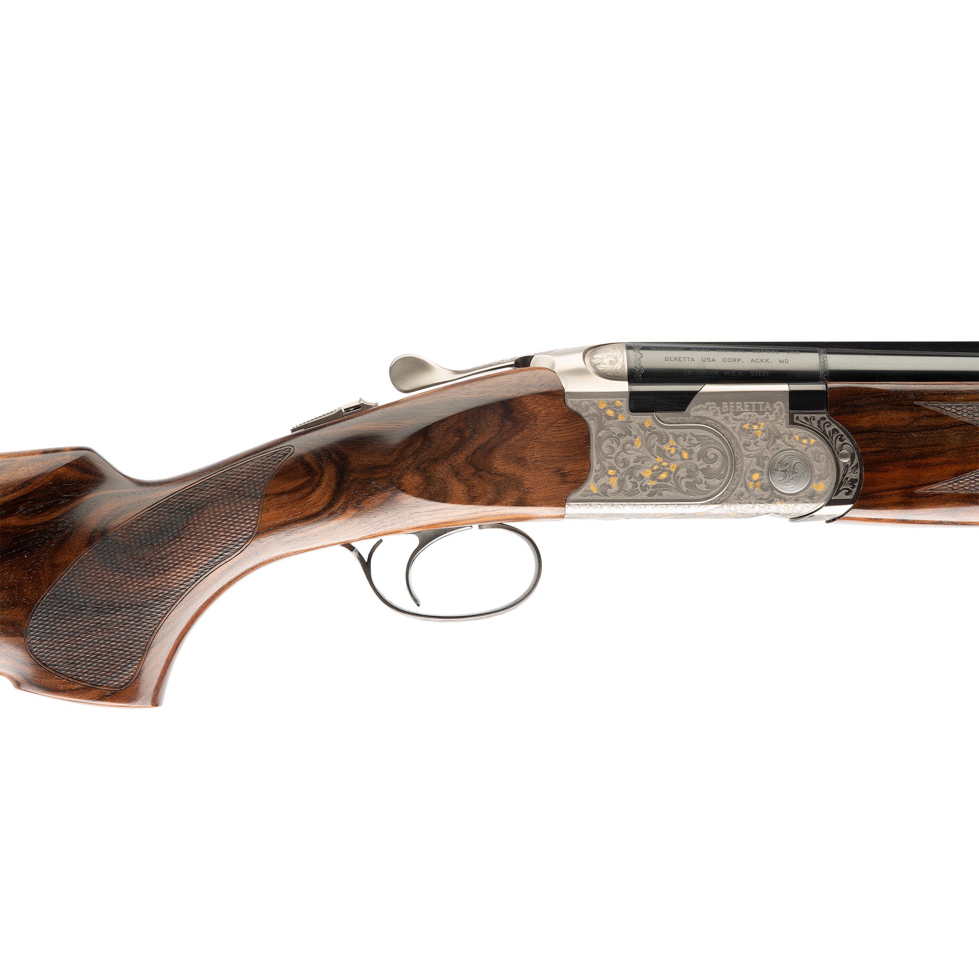 Close-up side view of a double-barrel shotgun showing the wooden stock, textured grip, engraved metal receiver, and trigger guard on a white background.