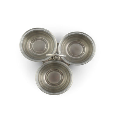 Set of three metallic bowls on a white background