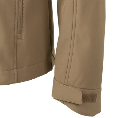 Close-up of a beige jacket with a patch on a white background