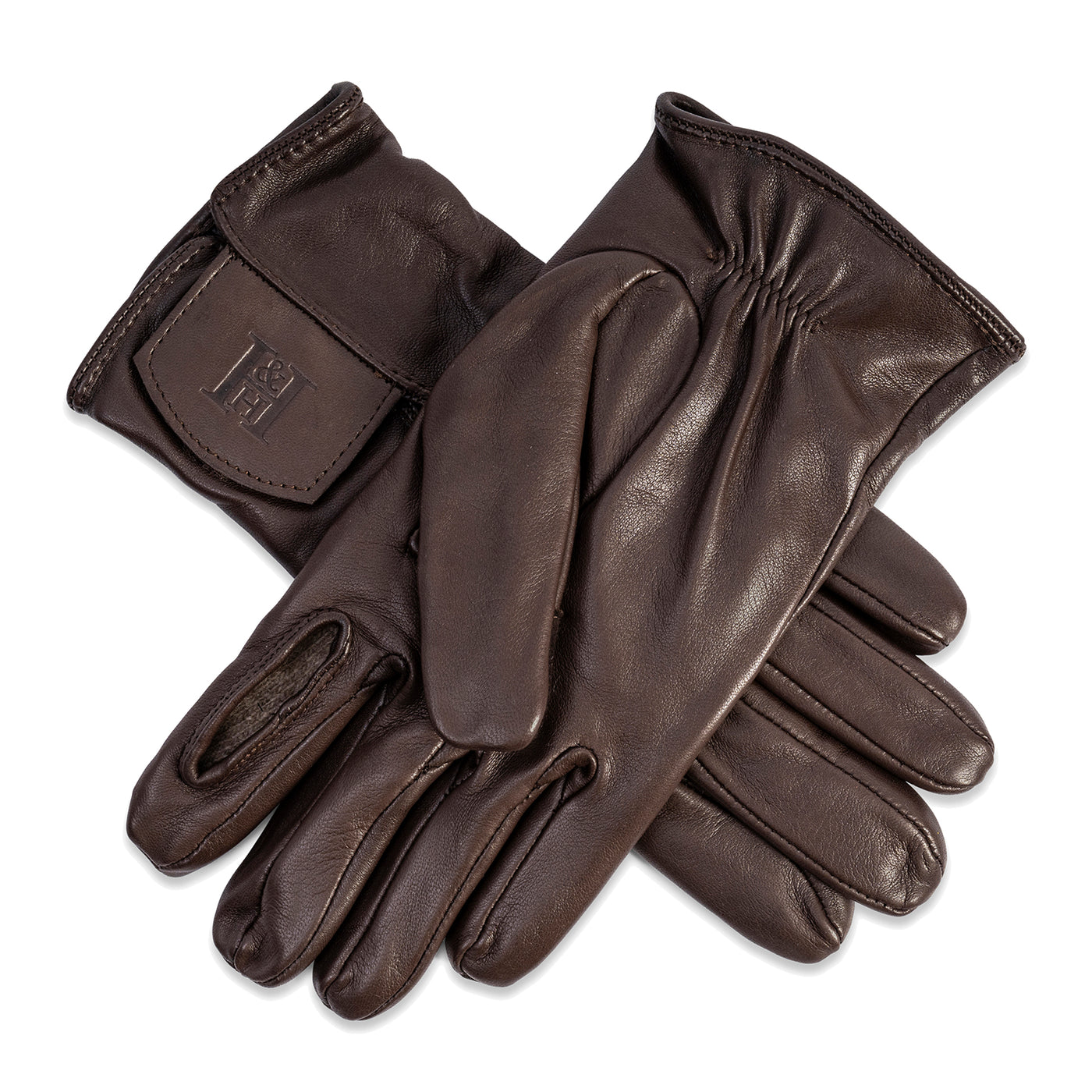A pair of brown leather shooting gloves with Kevlar lining, featuring a folding trigger finger design held in place by magnets.