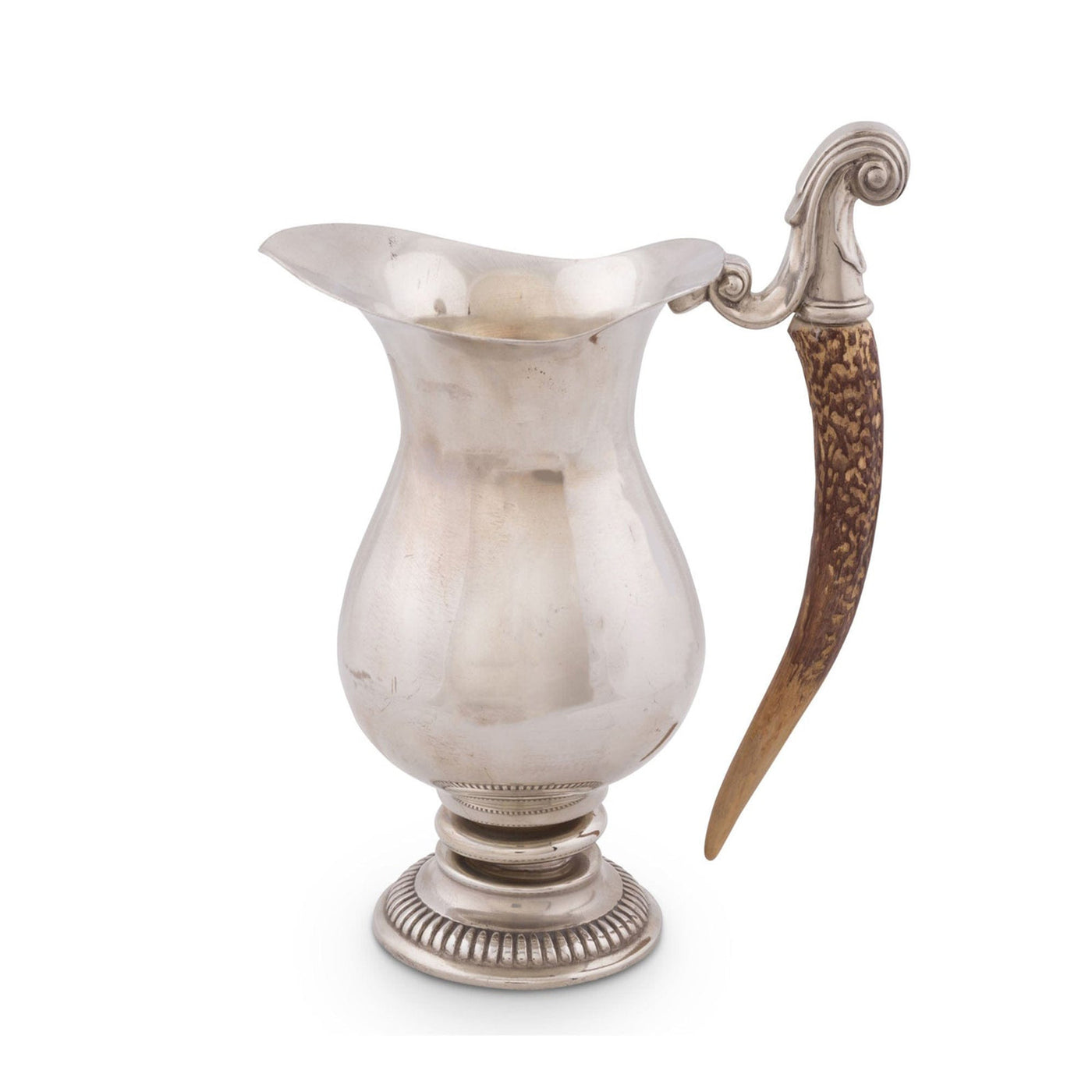 Silver pitcher with a decorative horn handle on a white background